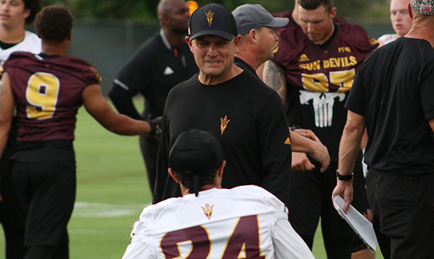 Arizona State assistant head coach Danny Gonzales chats with DB Chase Lucas during the team’s fir...
