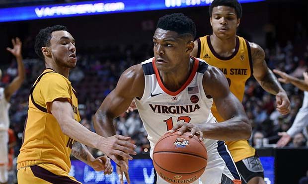 Virginia's Casey Morsell, right, dribbles around Arizona State's Jaelen House, left, during the sec...