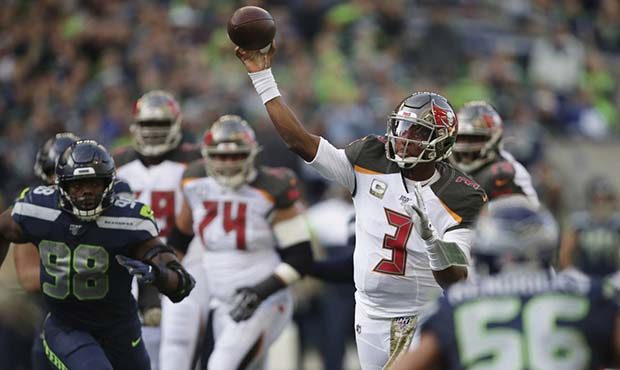Tampa Bay Buccaneers quarterback Jameis Winston passes to wide receiver Mike Evans (not shown) for ...