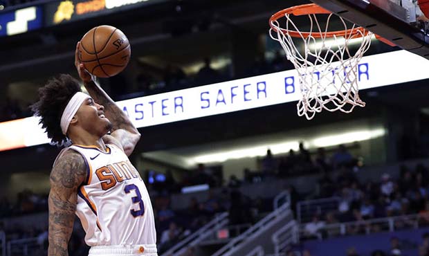 Phoenix Suns forward Kelly Oubre Jr. (3) dunks over Atlanta Hawks forward Jabari Parker (5) during ...