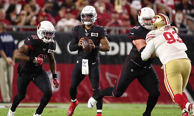 Quarterback Kyler Murray #1 of the Arizona Cardinals drops back to pass during the first half of th...