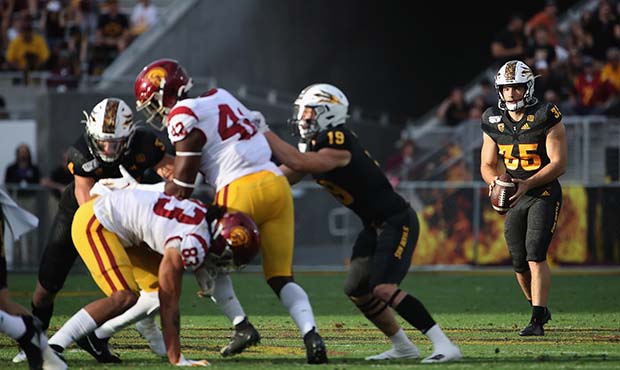 Punter Michael Turk #35 of the Arizona State Sun Devils in action during the second half of the NCA...