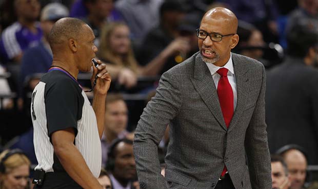 Phoenix Suns head coach Monty Williams, right, questions referee Michael Smith, left, about a play ...