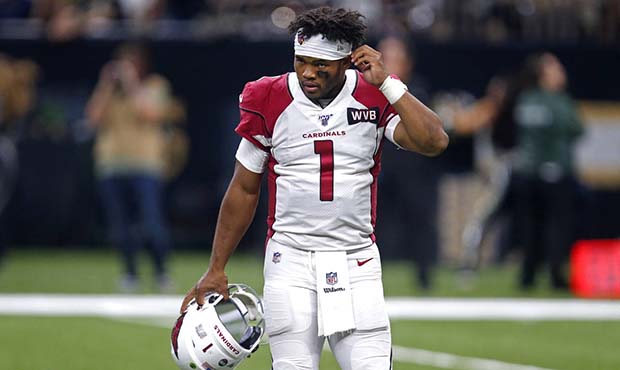 Arizona Cardinals quarterback Kyler Murray (1) walks off the field after being sacked in the second...