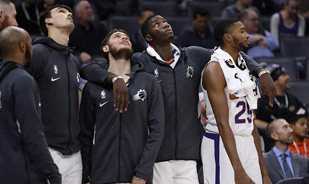 Phoenix Suns players, facing from left, Dario Saric, Tyler Johnson, Cheick Diallo and Mikal Bridges...