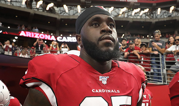 Defensive tackle Rodney Gunter #95 of the Arizona Cardinals walks out to the NFL preseason game aga...