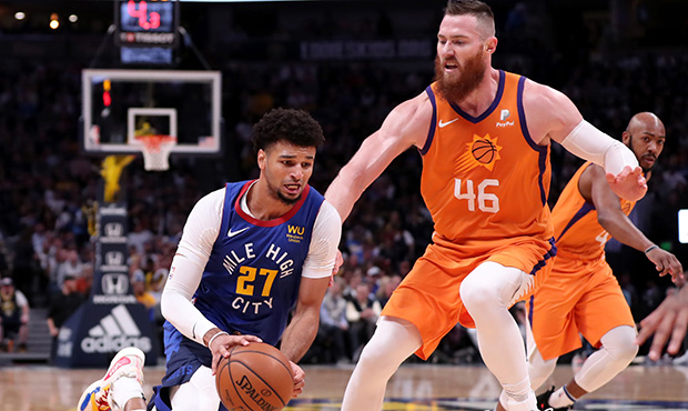 Jamal Murray #27 of the Denver Nuggets moves past the defense of Aron Baynes 46 of the Phoenix Suns...