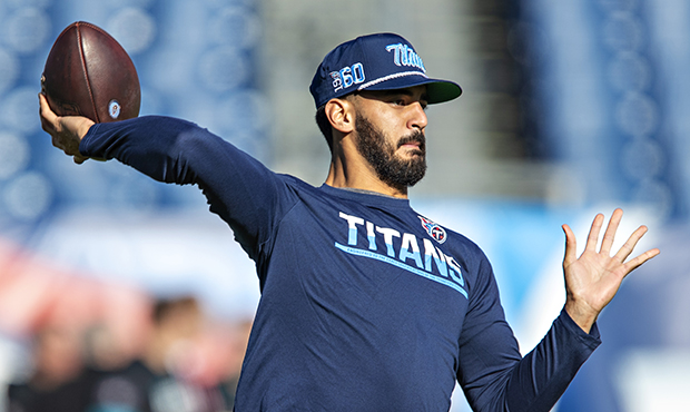 Marcus Mariota #8 of the Tennessee Titans warms up before a game against the Jacksonville Jaguars a...