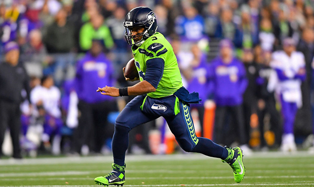 Russell Wilson #3 of the Seattle Seahawks scrambles for yardage during the first quarter against th...