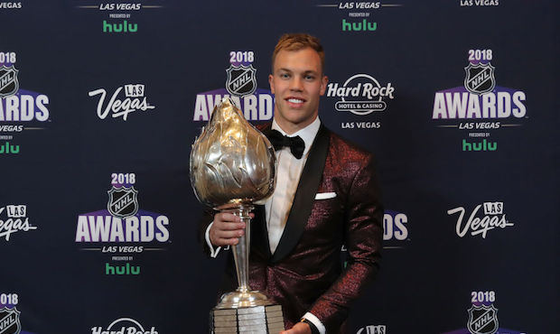 Taylor Hall of the New Jersey Devils poses with the Hart Trophy given to the most valuable player t...
