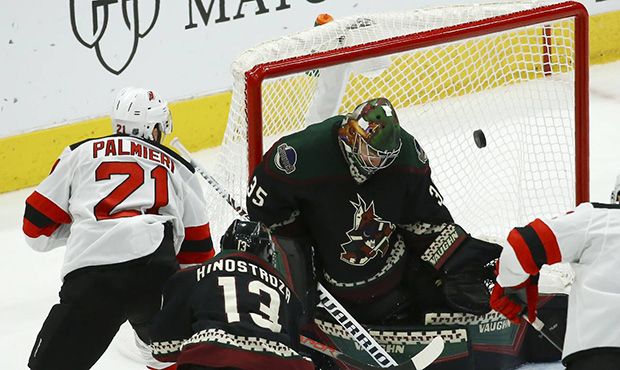 New Jersey Devils right wing Kyle Palmieri (21) scores a goal against Arizona Coyotes goaltender Da...