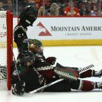 Arizona Coyotes defenseman Aaron Ness (42) collides with Coyotes goaltender Darcy Kuemper, right, during the first period of an NHL hockey game against the Chicago Blackhawks, Thursday, Dec. 12, 2019 in Glendale, Ariz. (AP Photo/Ross D. Franklin)