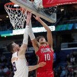 New Orleans Pelicans center Jaxson Hayes (10) goes to the basket against Phoenix Suns forward Frank Kaminsky (8) during the first half of an NBA basketball game in New Orleans, Thursday, Dec. 5, 2019. (AP Photo/Gerald Herbert)