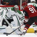 Arizona Coyotes left wing Taylor Hall (91) gets set to shoot against Dallas Stars goaltender Anton Khudobin (35) during the first period of an NHL hockey game Sunday, Dec. 29, 2019, in Glendale, Ariz. (AP Photo/Ross D. Franklin)