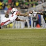 Oregon safety Jevon Holland (8) breaks up a pass for Utah wide receiver Jaylen Dixon (25) during the first half of the Pac-12 Conference championship NCAA college football game in Santa Clara, Calif., Friday, Dec. 6, 2018. (AP Photo/Tony Avelar)