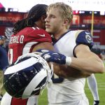 Los Angeles Rams wide receiver Cooper Kupp, right, greets Arizona Cardinals wide receiver Larry Fitzgerald after an NFL football game, Sunday, Dec. 1, 2019, in Glendale, Ariz. The Rams won 34-7. (AP Photo/Rick Scuteri)