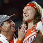 Clemson coach Dabo Swinney celebrates with quarterback Trevor Lawrence after Clemson defeated Ohio State 29-23 in the Fiesta Bowl NCAA college football playoff semifinal Saturday, Dec. 28, 2019, in Glendale, Ariz. (AP Photo/Ross D. Franklin)