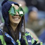A Seattle Seahawks fan wears Christmas tree glasses during the first half of an NFL football game against the Arizona Cardinals, Sunday, Dec. 22, 2019, in Seattle. (AP Photo/Lindsey Wasson)