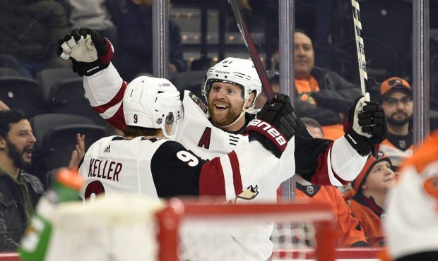 Arizona Coyotes' Phil Kessel, right, celebrates with Clayton Keller after Kessel scored a goal past...