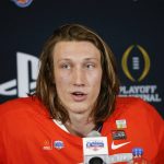 Clemson quarterback Trevor Lawrence speaks during a news conference after the team's 29-23 win over Ohio State in the Fiesta Bowl NCAA college football playoff semifinal Saturday, Dec. 28, 2019, in Glendale, Ariz. (AP Photo/Ross D. Franklin)