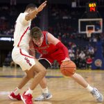St. John's guard David Caraher (5) collides with Arizona guard Jemarl Baker Jr. during the first half of an NCAA college basketball game Saturday, Dec. 21, 2019, in San Francisco. (AP Photo/D. Ross Cameron)