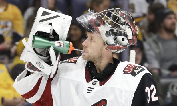 Arizona Coyotes goaltender Antti Raanta, of Finland, takes a drink during a stop in play in the sec...