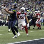 Seattle Seahawks fullback Nick Bellore (44) catches a pass for a touchdown ahead of Arizona Cardinals linebacker Joe Walker (59) to score a touchdown during the first half of an NFL football game, Sunday, Dec. 22, 2019, in Seattle. (AP Photo/Lindsey Wasson)
