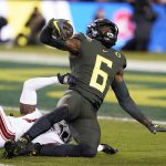 Oregon wide receiver Juwan Johnson (6) catches pass against Utah defensive back Jaylon Johnson (1) during the first half of the Pac-12 Conference championship NCAA college football game in Santa Clara, Calif., Friday, Dec. 6, 2018. (AP Photo/Tony Avelar)