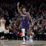 Phoenix Suns forward Kelly Oubre Jr. reacts after making a 3-point basket against the Portland Trail Blazers during the second half of an NBA basketball game in Portland, Ore., Monday, Dec. 30, 2019. The Suns won 122-116. (AP Photo/Craig Mitchelldyer)
