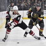 Arizona Coyotes left wing Taylor Hall (91) skates with the puck against Vegas Golden Knights center Paul Stastny during the first period of an NHL hockey game Saturday, Dec. 28, 2019, in Las Vegas. (AP Photo/David Becker)