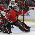 Chicago Blackhawks goalie Robin Lehner blocks a shot by Arizona Coyotes center Christian Dvorak during the first period of an NHL hockey game Sunday, Dec. 8, 2019, in Chicago. (AP Photo/Nam Y. Huh)