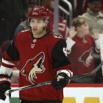 Arizona Coyotes left wing Taylor Hall warms up with teammates prior to an NHL hockey game against the Minnesota Wild on Thursday, Dec. 19, 2019, in Glendale, Ariz. Hall was acquired in a trade with the New Jersey Devils. (AP Photo/Ross D. Franklin)