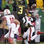 Oregon wide receiver Johnny Johnson III (3) catches a passes between Utah defensive backs R.J. Hubert (10) and Josh Nurse (14) during the first half of the Pac-12 Conference championship NCAA college football game in Santa Clara, Calif., Friday, Dec. 6, 2018. (AP Photo/Tony Avelar)