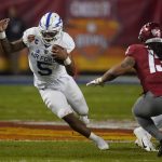 Air Force quarterback Donald Hammond III (5) runs for a first down against Washington State during the first half during the Cheez-It Bowl NCAA college football game, Friday, Dec. 27, 2019, in Phoenix. (AP Photo/Rick Scuteri)