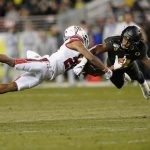 Oregon safety Jevon Holland (8) breaks up a pass for Utah wide receiver Jaylen Dixon (25) during the first half of the Pac-12 Conference championship NCAA college football game in Santa Clara, Calif., Friday, Dec. 6, 2018. (AP Photo/Tony Avelar)