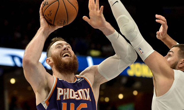 Phoenix Suns center Aron Baynes (46) shoots against Memphis Grizzlies center Jonas Valanciunas, rig...