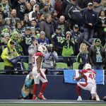 Arizona Cardinals running back Kenyan Drake (41) reacts in front of Seattle Seahawks fans after running 80 yards for a touchdown against the Seahawks during the first half of an NFL football game, Sunday, Dec. 22, 2019, in Seattle. Cardinals' Christian Kirk (13) looks on. (AP Photo/Lindsey Wasson)