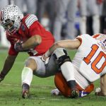 Ohio State quarterback Justin Fields is sacked by Clemson linebacker Baylon Spector during the second half of the Fiesta Bowl NCAA college football playoff semifinal Saturday, Dec. 28, 2019, in Glendale, Ariz. (AP Photo/Ross D. Franklin)