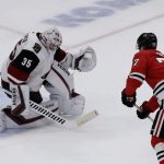 Arizona Coyotes goalie Darcy Kuemper, blocks a shot by Chicago Blackhawks center Kirby Dach in a shootout of an NHL hockey game Sunday, Dec. 8, 2019, in Chicago. The Coyotes defeated the Blackhawks 4-3. (AP Photo/Nam Y. Huh)