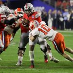 Ohio State quarterback Justin Fields is sacked by Clemson linebacker Baylon Spector during the second half of the Fiesta Bowl NCAA college football playoff semifinal Saturday, Dec. 28, 2019, in Glendale, Ariz. (AP Photo/Rick Scuteri)