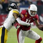 Arizona Cardinals wide receiver Larry Fitzgerald (11) is hit by Pittsburgh Steelers strong safety Terrell Edmunds during the second half of an NFL football game, Sunday, Dec. 8, 2019, in Glendale, Ariz. (AP Photo/Rick Scuteri)