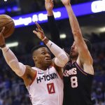 Houston Rockets guard Russell Westbrook (0) drives past Phoenix Suns forward Frank Kaminsky (8) during the first half of an NBA basketball game Saturday, Dec. 21, 2019, in Phoenix. (AP Photo/Ross D. Franklin)