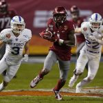 Washington State wide receiver Davontavean Martin (1) runs away from Air Force defenders during the first half of the Cheez-It Bowl NCAA college football game Friday, Dec. 27, 2019, in Phoenix. (AP Photo/Rick Scuteri)