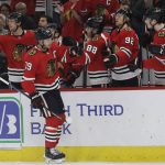 Chicago Blackhawks center Jonathan Toews (19) celebrates with teammates after scoring his goal during the first period of an NHL hockey game against the Arizona Coyotes, Sunday, Dec. 8, 2019, in Chicago. (AP Photo/Nam Y. Huh)
