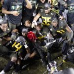 Oregon players celebrate after defeating Utah 37-15 in an NCAA college football game for the Pac-12 Pac-12 Conference championship, in Santa Clara, Calif., Friday, Dec. 6, 2018.(AP Photo/Tony Avelar)