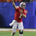 Ohio State quarterback Justin Fields throws a pass against Clemson during the second half of the Fiesta Bowl NCAA college football playoff semifinal Saturday, Dec. 28, 2019, in Glendale, Ariz. (AP Photo/Ross D. Franklin)