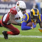 Los Angeles Rams running back Todd Gurley is tackled by Arizona Cardinals cornerback Patrick Peterson during first half of an NFL football game Sunday, Dec. 29, 2019, in Los Angeles. (AP Photo/Mark J. Terrill)
