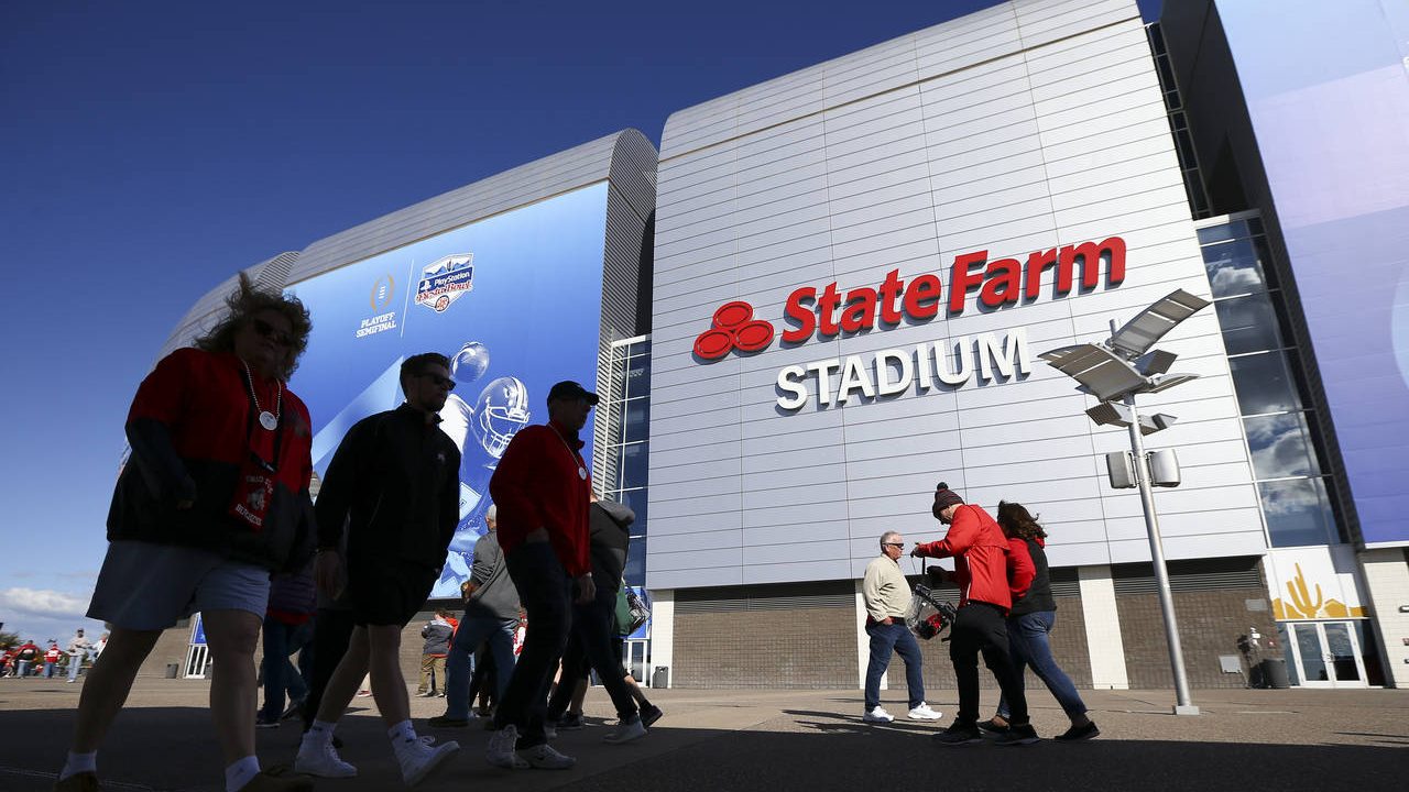 Fans arrives for the Fiesta Bowl NCAA college football game between Clemson and Ohio State, Saturda...