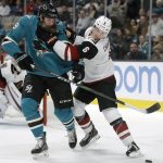 San Jose Sharks' Joe Thornton, left, and Arizona Coyotes' Jakob Chychrun (6) fight for the puck in the first period of an NHL hockey game Tuesday, Dec. 17, 2019, in San Jose, Calif. (AP Photo/Ben Margot)