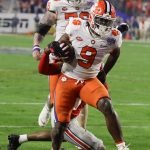 Clemson running back Travis Etienne scores against Ohio State during the first half of the Fiesta Bowl NCAA college football playoff semifinal Saturday, Dec. 28, 2019, in Glendale, Ariz. (AP Photo/Rick Scuteri)